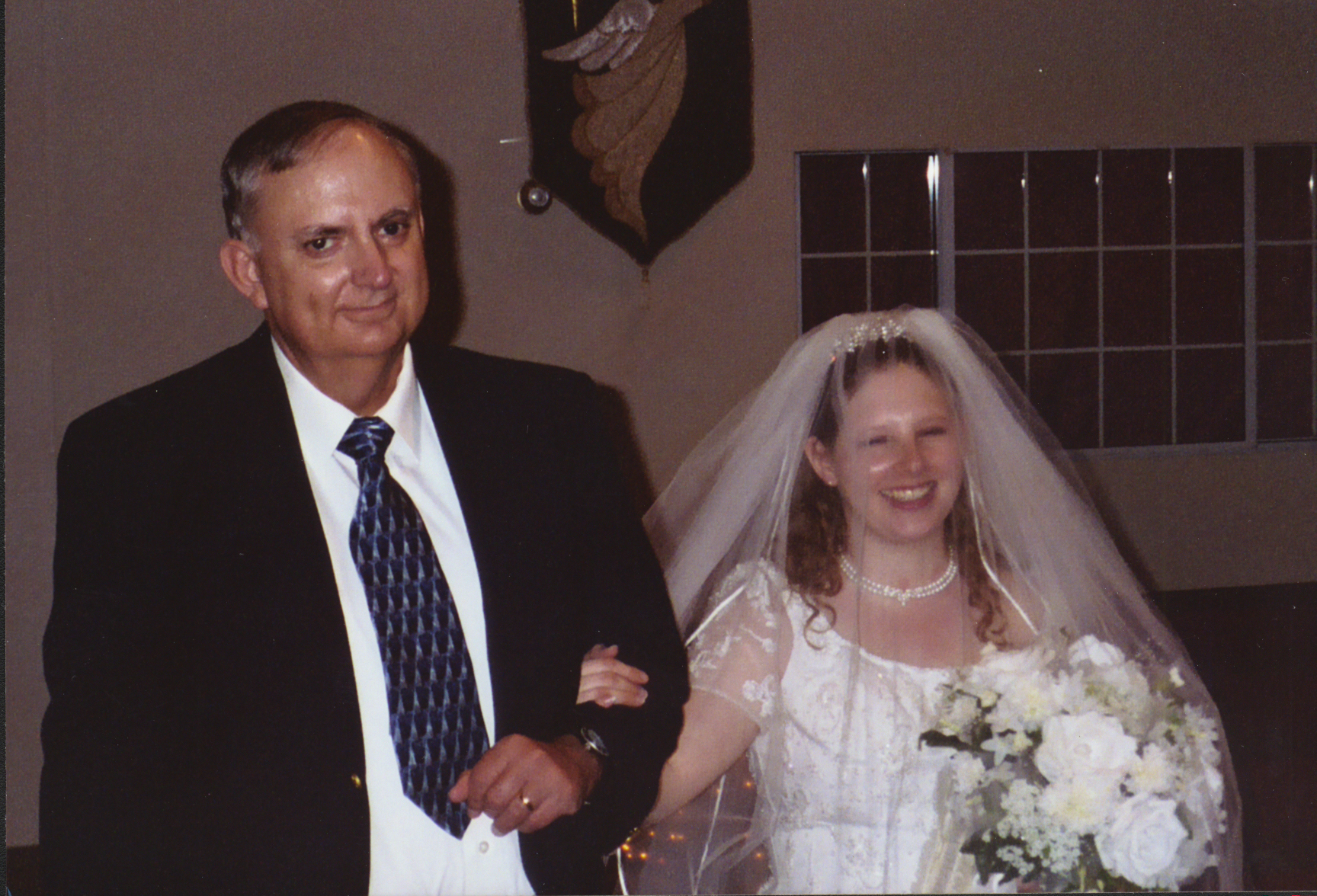 Ben walking his future daughter-in-law, Kelly, down the aisle