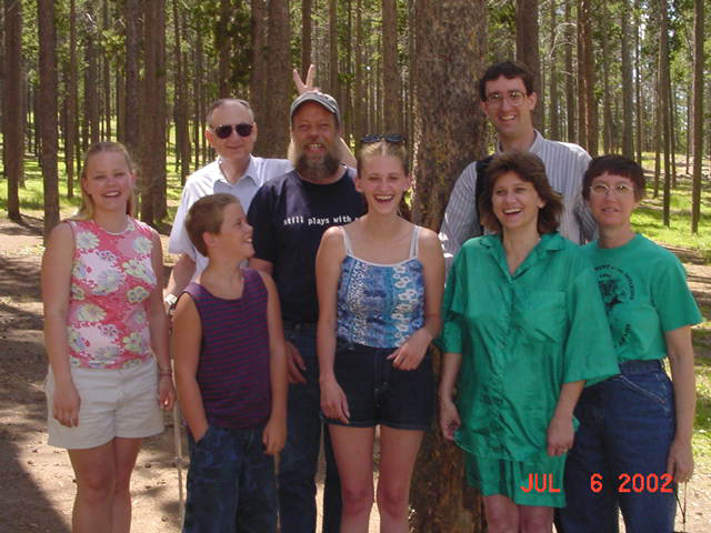 The Browns and Hansens on Casper Mountain - Front Row: Terra, TJ, Natasha and Natalie Hansen and Faye Brown; Back Row: Uncle Ben, Doug Hansen and Steven Brown (July 6, 2002)